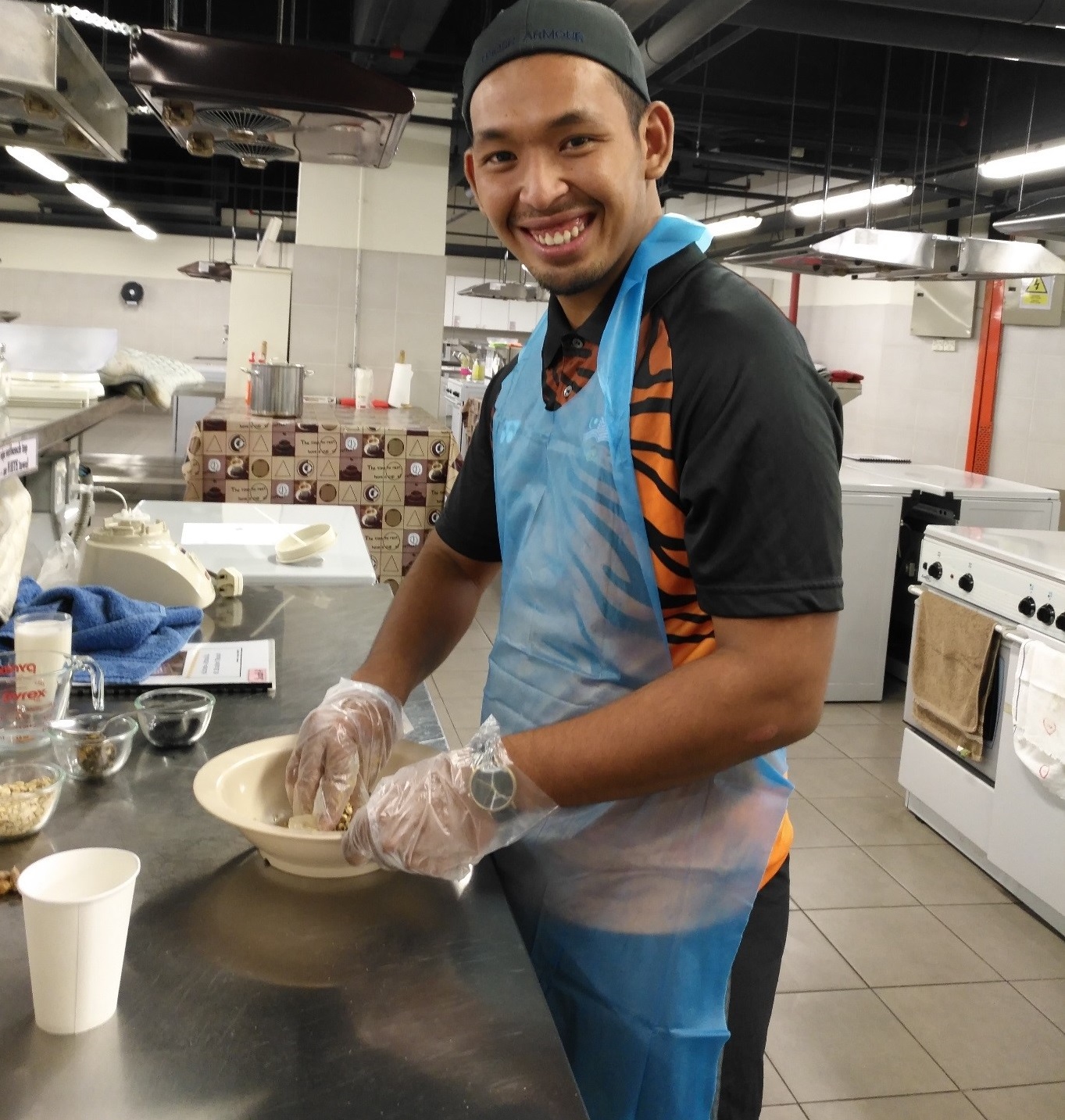 A Malaysian athlete prepares snack at IMU